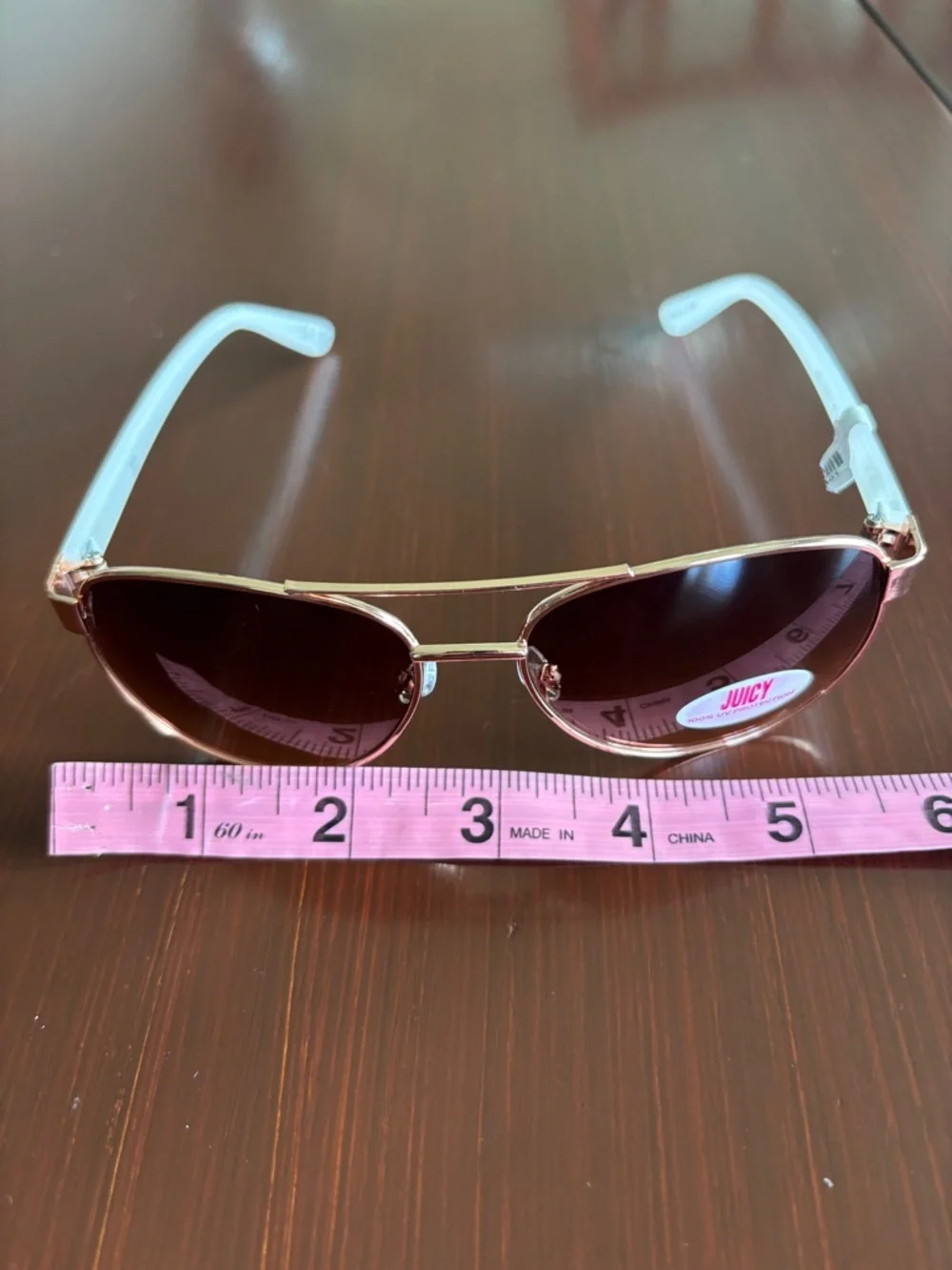 Juicy Coutture 100% UVA-UVB protect,brown gradient lens,gold frame,white arms